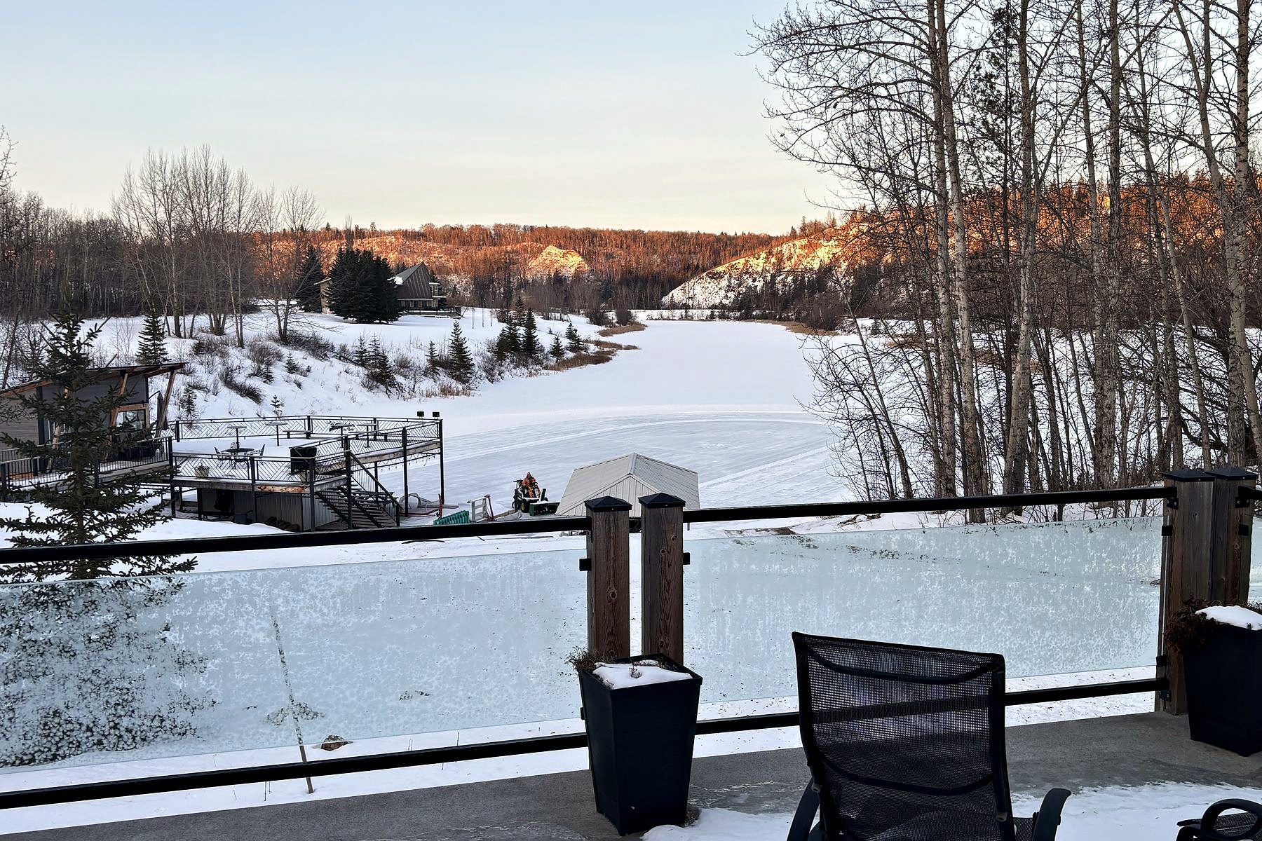 Looking out from the deck in January, over the frozen lake and the dock